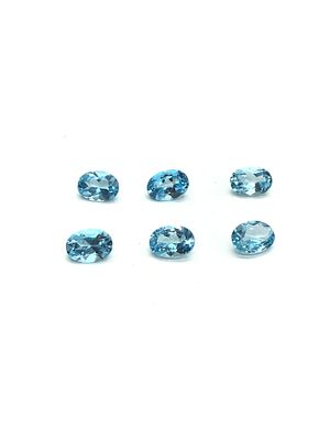 Blue topaz gemstones. Oval cut blue topazes. 5.75 carats total.