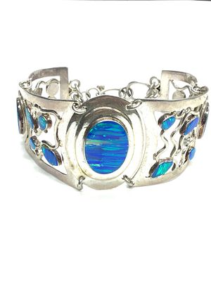 .950 silver bracelet. .950 bracelet with multiple opals. 29.23 grams total weight. 7 inches 