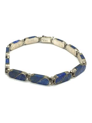 .950 silver bracelet. .950 bracelet with lapis inlay. 15.57 grams total weight. 7.5 inches length.