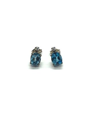 Sterling silver earrings. Sterling earrings with blue topaz gemstones. 1.87 grams total weight.