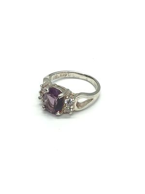 Sterling silver ring. Sterling ring with purple and clear gemstones. 4.02 grams total weight. Size 6.