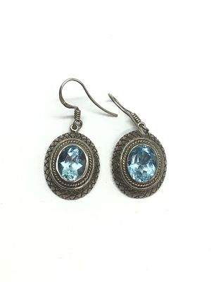 Sterling silver earrings. Sterling earrings with blue topaz gemstones. 7.73 grams total weight.