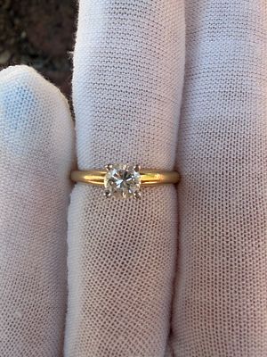 Solitaire engagement ring features a sparkling .50 carat round diamond. This beautiful solitaire 