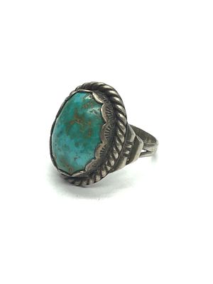 Artisan made ring. Sterling silver ring with turquoise stone. 12.05 grams total weight. Size 12.