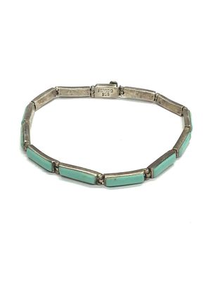 Artisan made bracelet. .950 Sterling bracelet with turquoise stones. 6.47 grams total weight. 7 