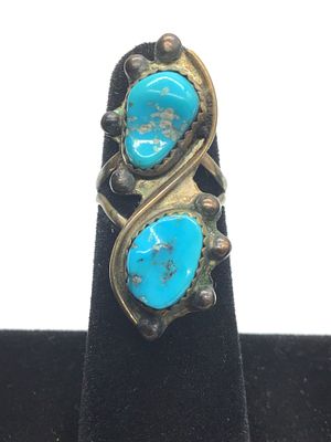 Artisan handmade ring. Sterling silver ring with turquoise stones. 5.62 grams total weight. Size 5