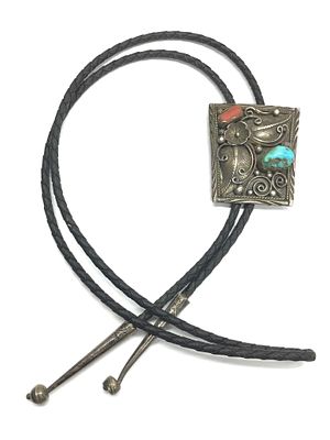 Navajo handmade bolo. Bolo with sterling silver clasp featuring turquoise and red coral stones. 