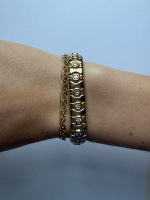 Natural Diamond Bracelet - Approx. 1.10 CTW - Two-Tone Gold. Elegant and substantial natural 