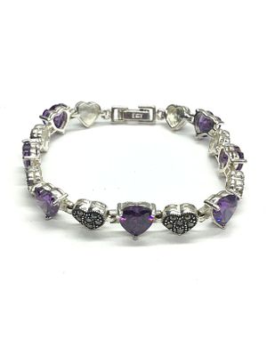 Sterling silver ring. Sterling ring with purple CZ gemstones. 17.40 grams total weight. 7.5 