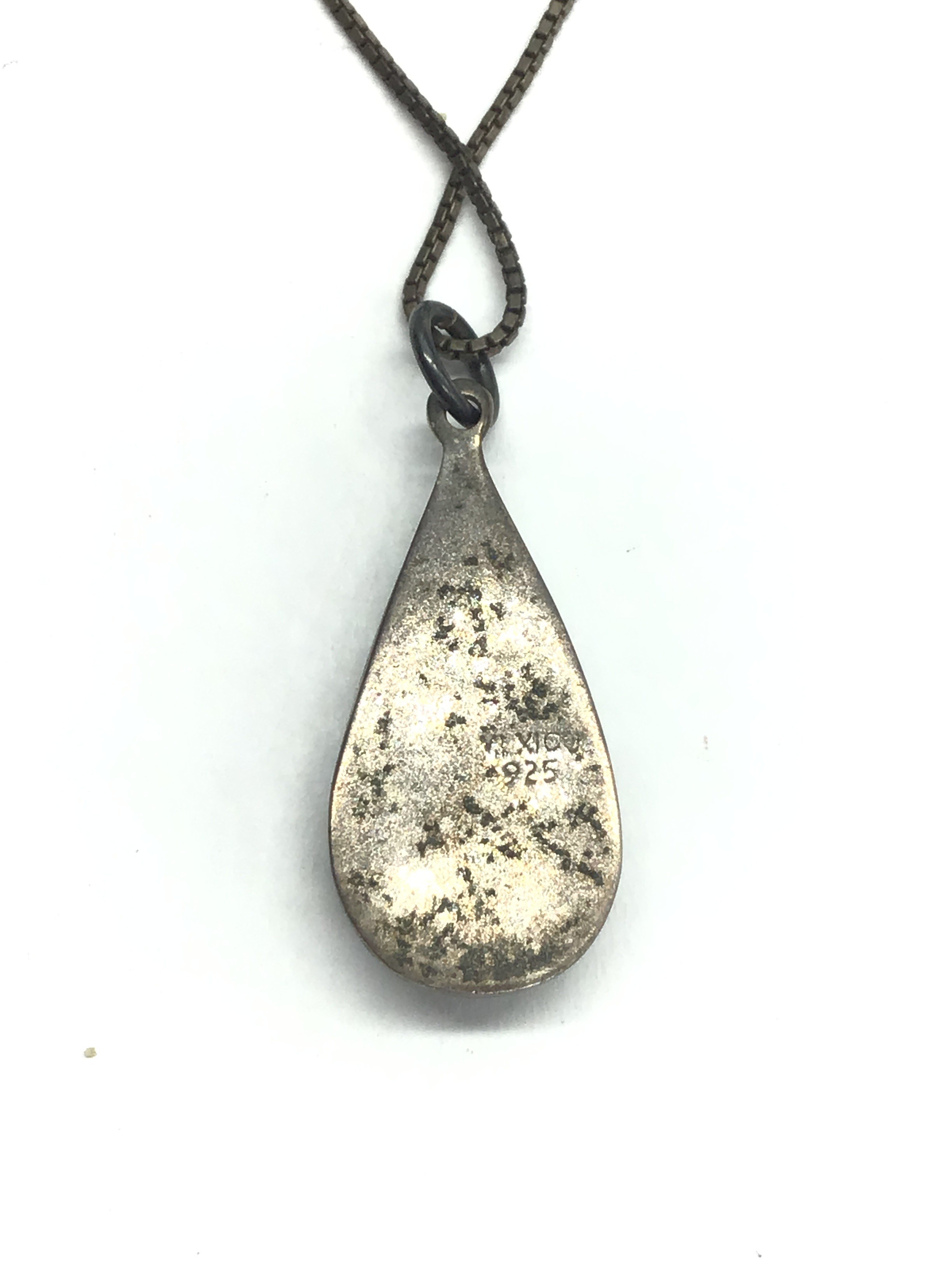 Sterling silver necklace with artisan made pendant