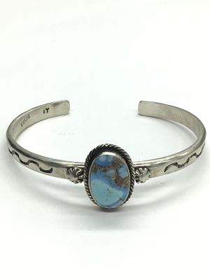 Sam Yellowhair Navajo turquoise cuff bracelet. Sterling silver cuff with a Golden Hills 