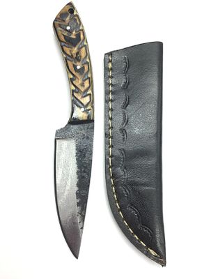 Steel bladed knife with sheath. 4 inch blade length.