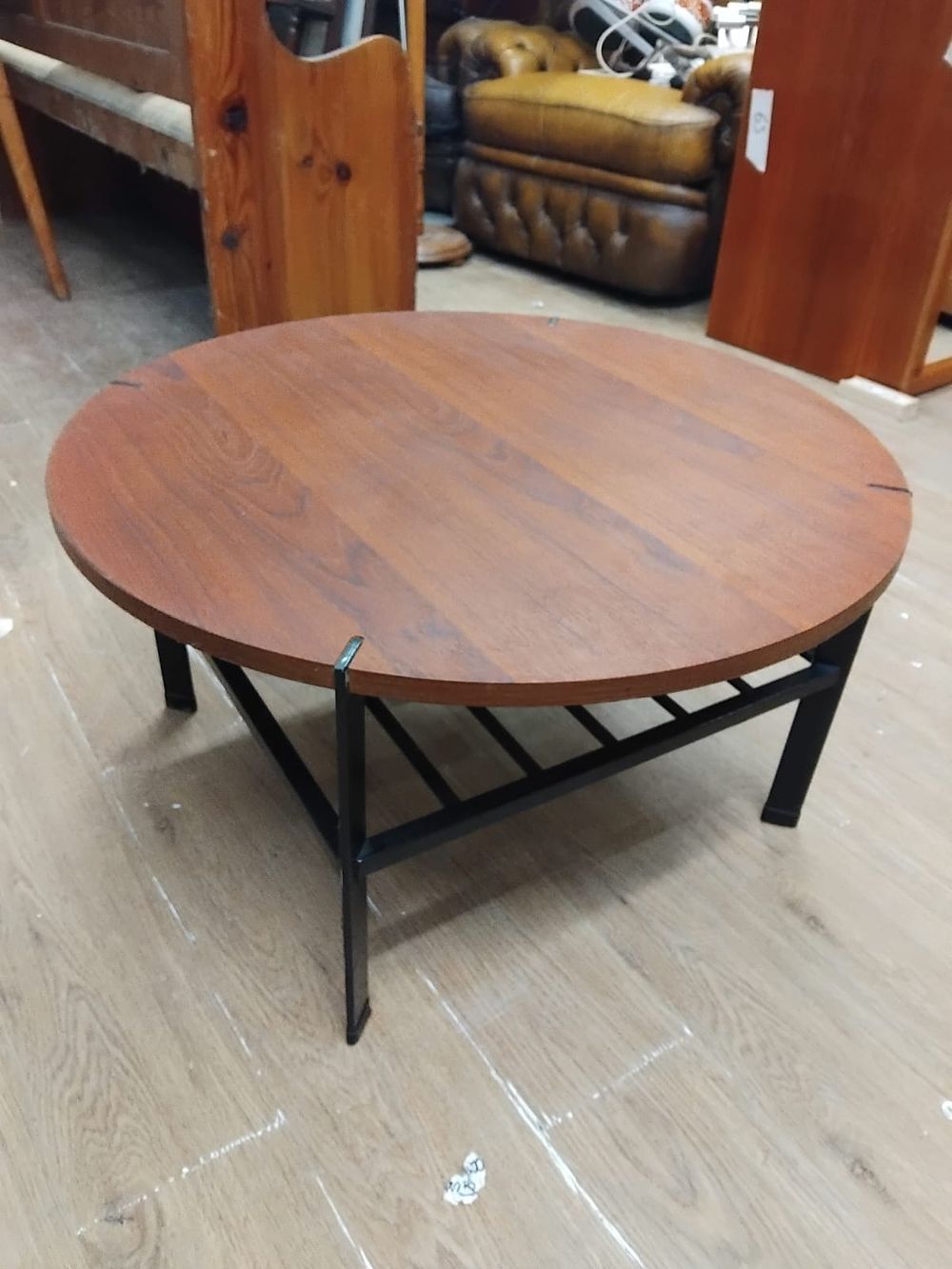 Lot 156 – Mid-Century Modern circular teak and black-painted metal coffee table