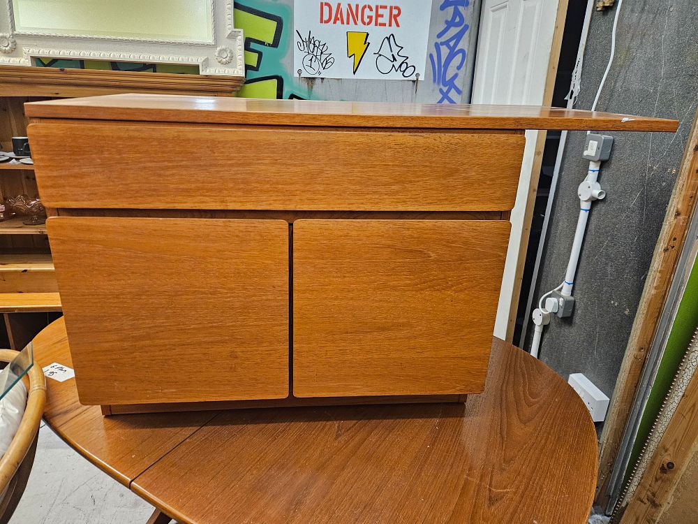 Lot 162 – Mid-century modern teak cabinet with pull-out slide, circa 1960s