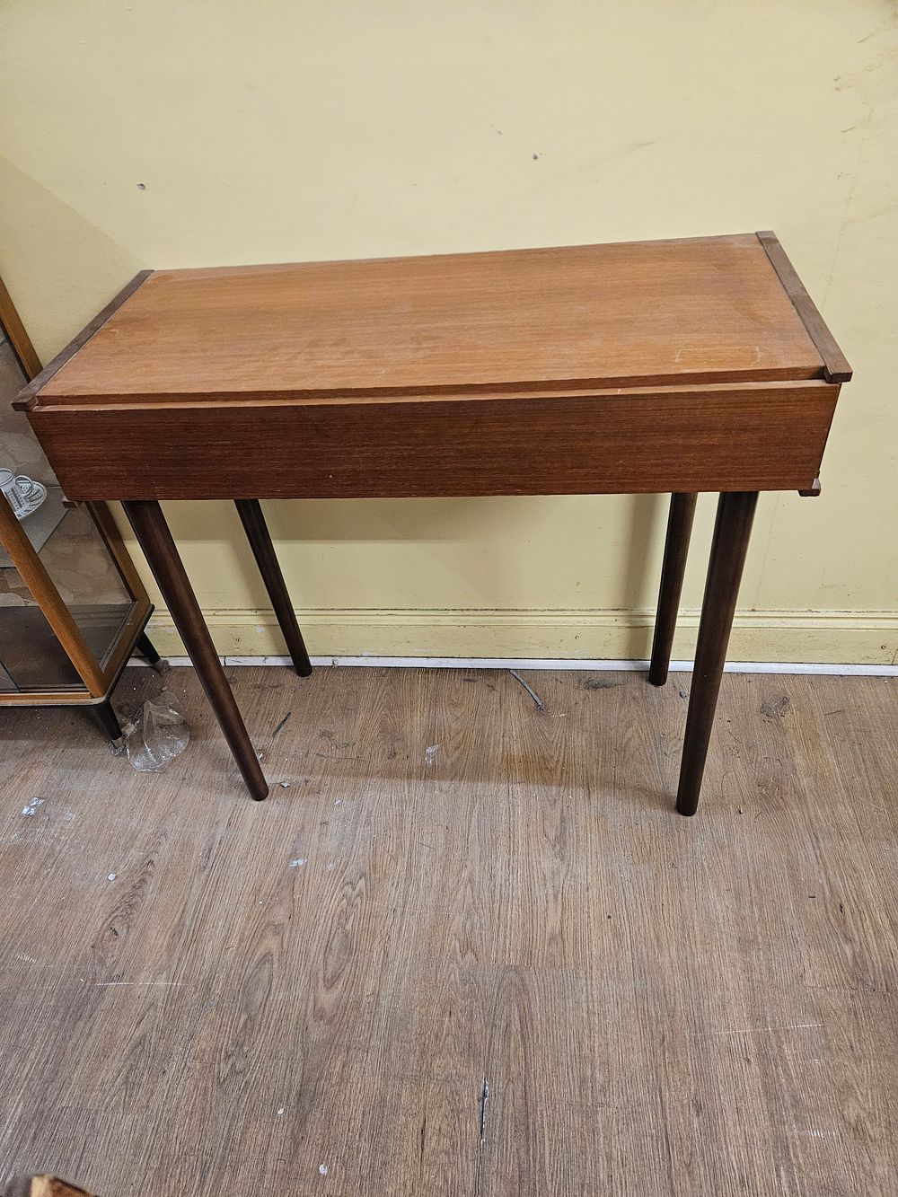 Lot 165 – A mid-century modern teak veneer console table with sliding top, circa 1960s