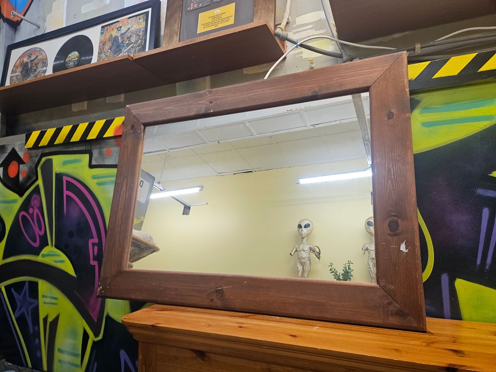 Lot 177 – A large late 20th-century rustic stained pine wall mirror