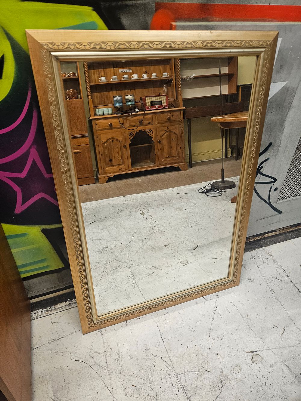 Lot 179 – A large contemporary gilt-effect bevelled wall mirror with Celtic-style knot-work border