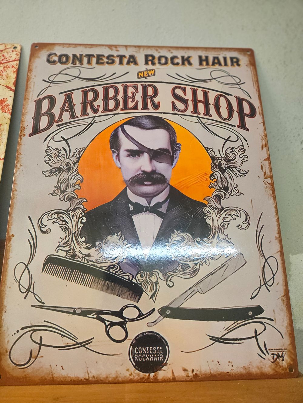 Lot 183 – A Contesta Rock Hair Barber Shop decorative metal advertising sign