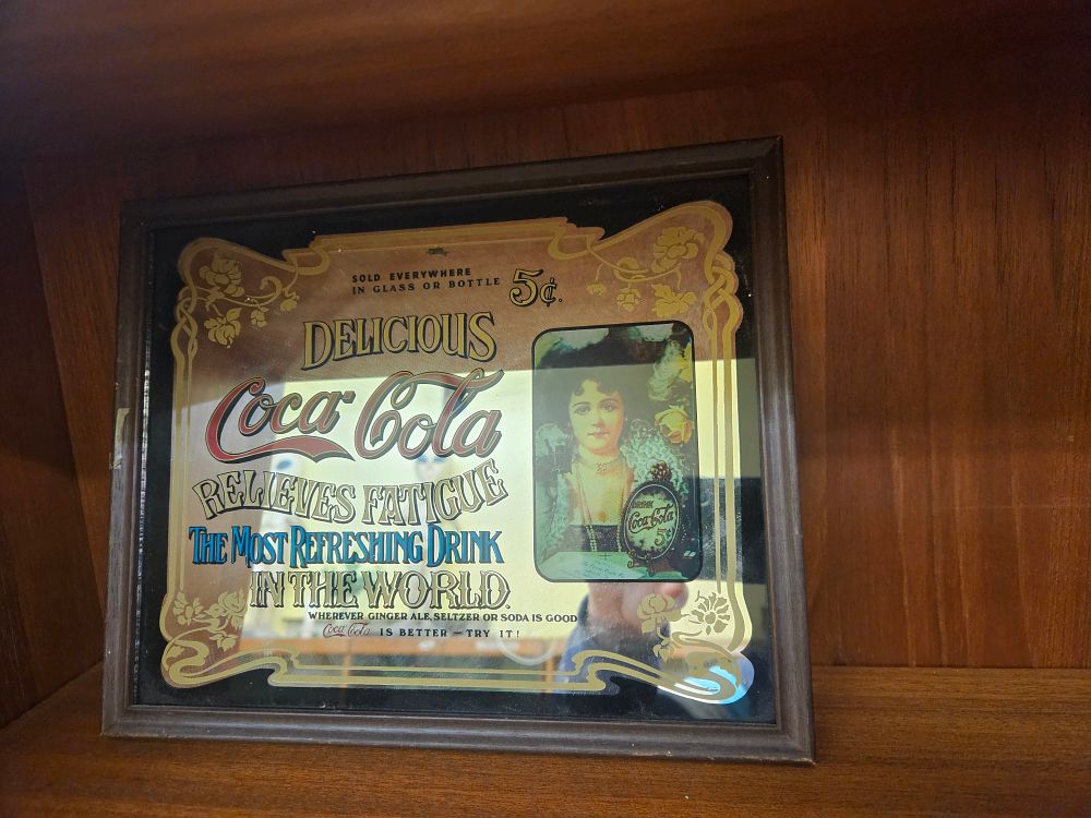 Lot 185 – A Vintage Coca-Cola Advertising Bar Mirror in a Wooden Frame