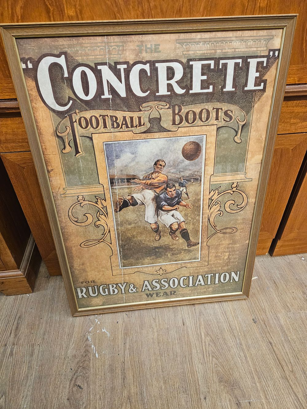 Lot 199 – Framed Vintage Style Concrete Football Boots Advertising Print