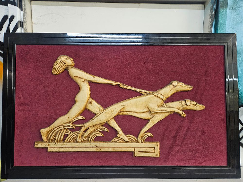 Lot 206 – An Art Deco Style Framed Composition Relief Plaque Depicting a Nude Figure with Hounds
