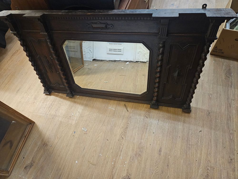 Lot 207 – A Jacobean Revival oak overmantel mirror retailed by Jones and Higgins Ltd