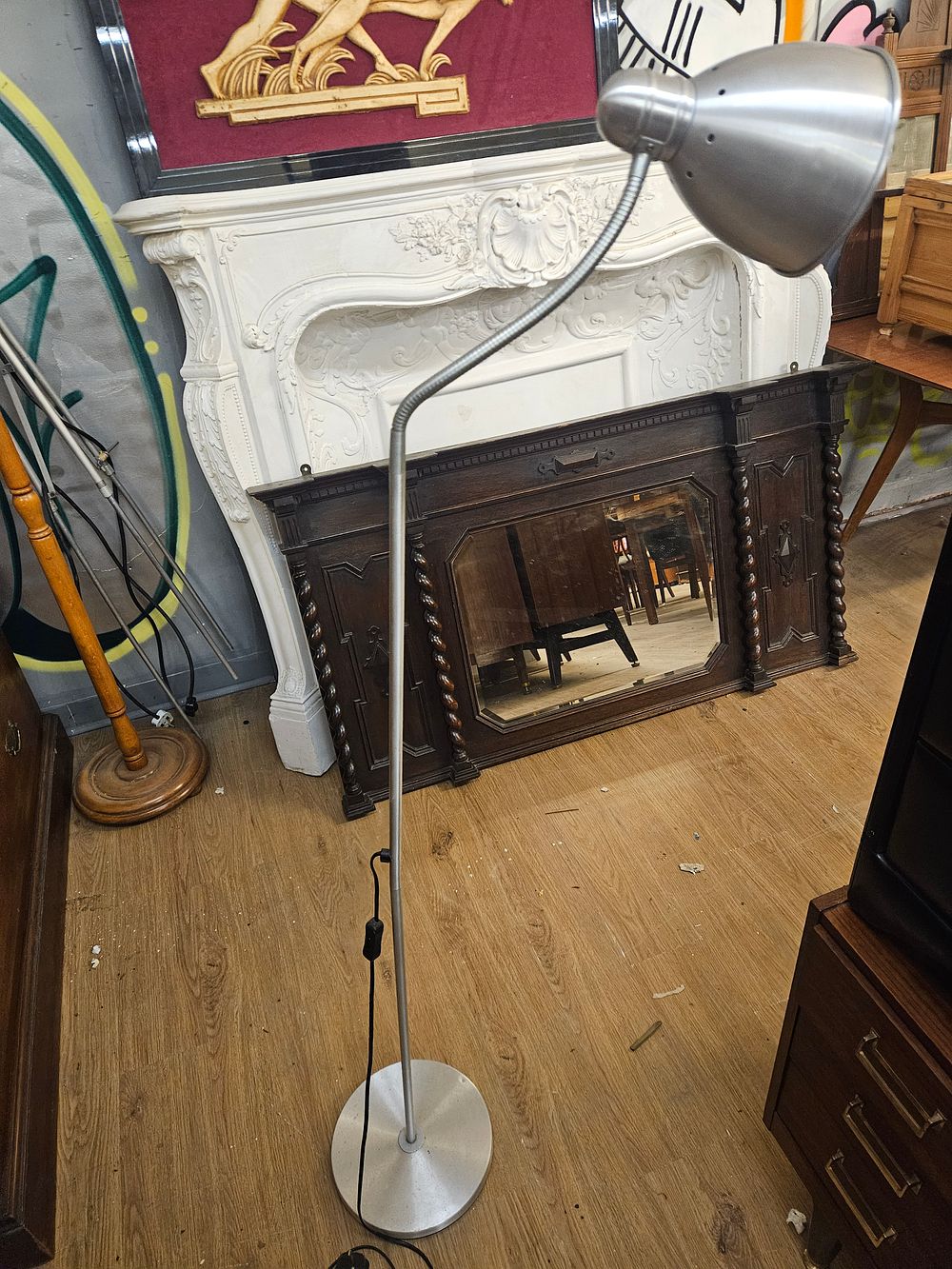 Lot 213 – A modern adjustable metal floor lamp with gooseneck stem
