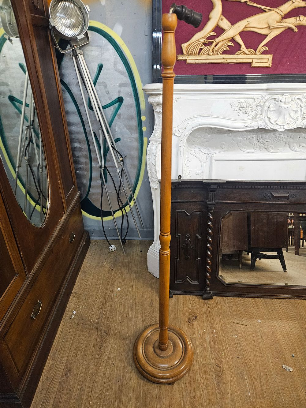Lot 215 – A mid-20th-century turned wood standard lamp