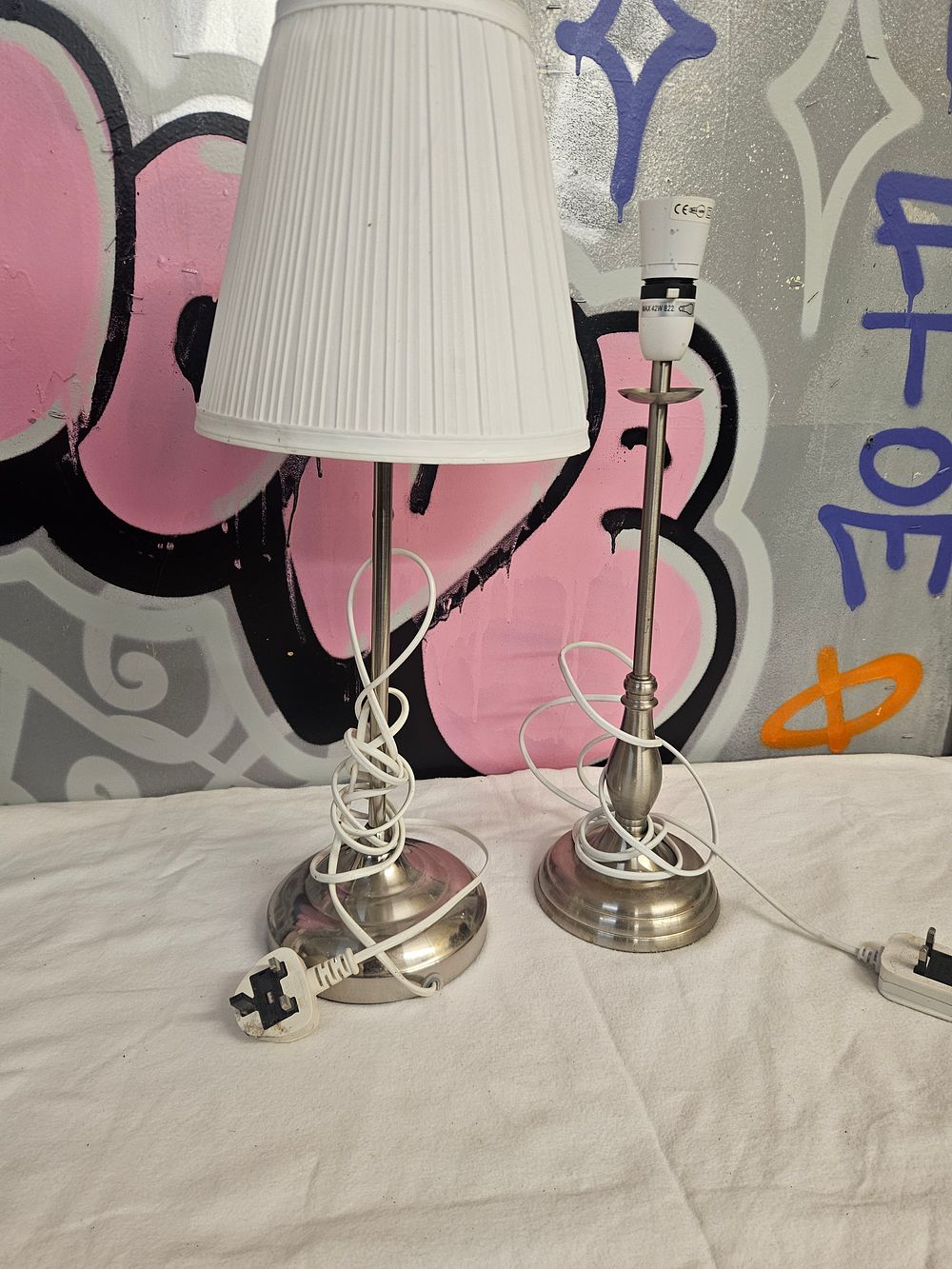 Lot 218 – A Pair of IKEA ARSTID Table Lamps in Nickel-Plated Finish