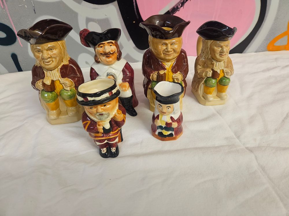 Lot 225 – A Collection of Six Staffordshire Glazed Earthenware Toby Jugs