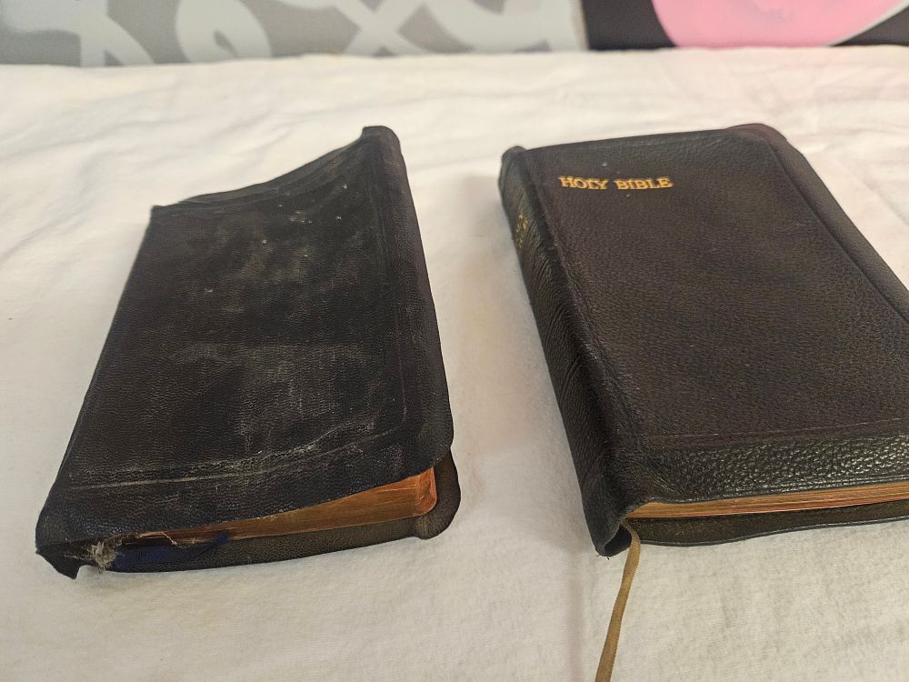 Lot 234 – A Trio of Religious Volumes comprising Two Bibles and a Small Missal, circa early 20th Century