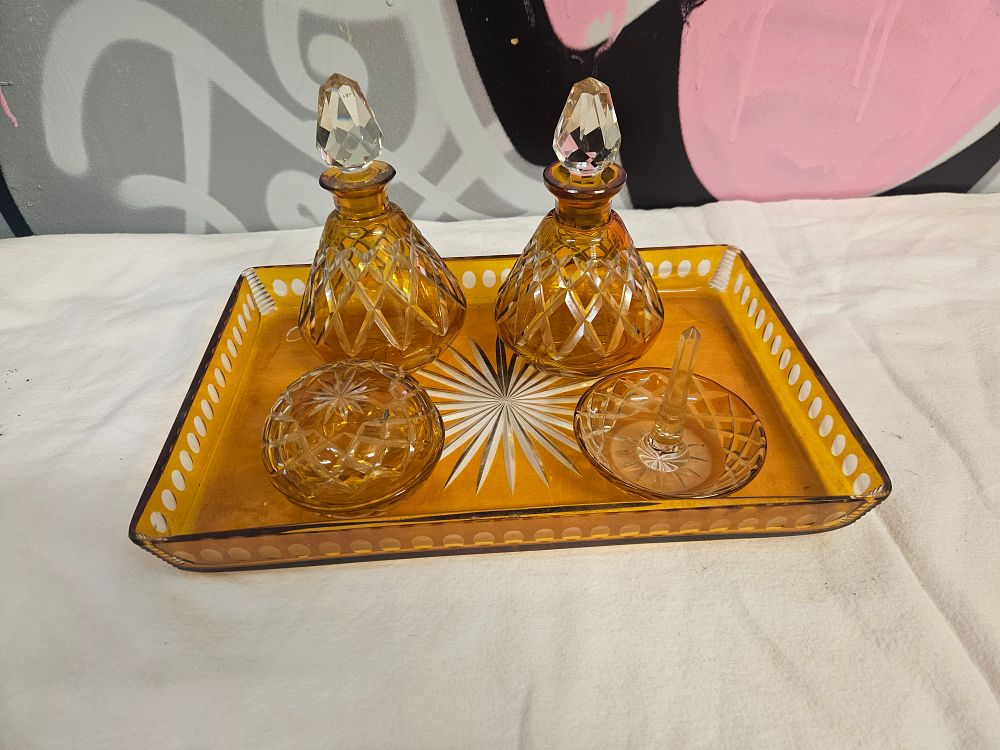 Lot 243 – A Six-Piece Set of Art Deco Amber Cut Glass Dressing Table Items