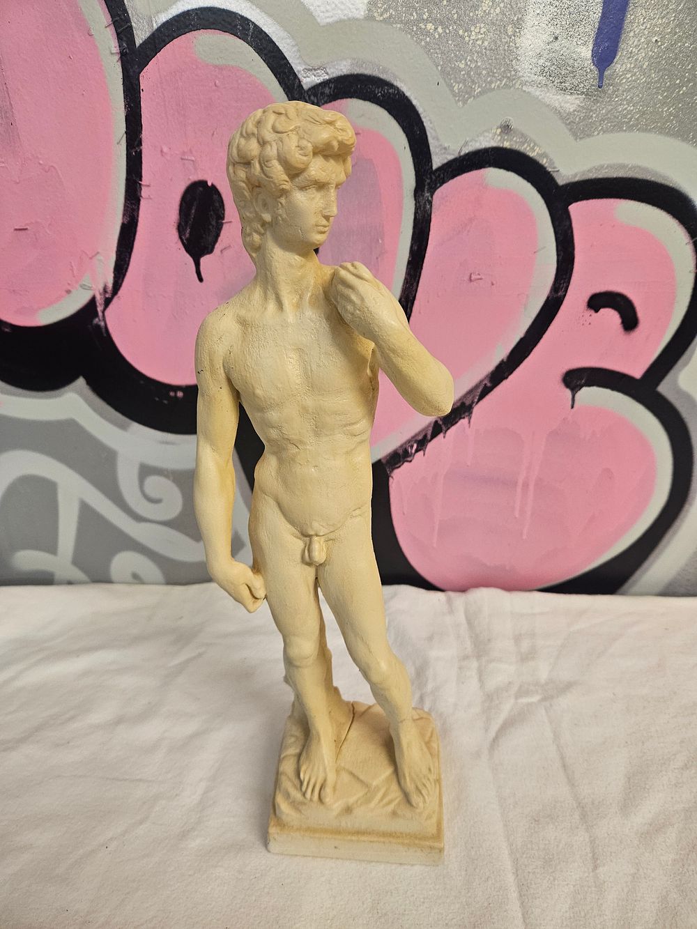 Lot 251 – A Small-Scale Bonded Marble Figure of David, After Michelangelo