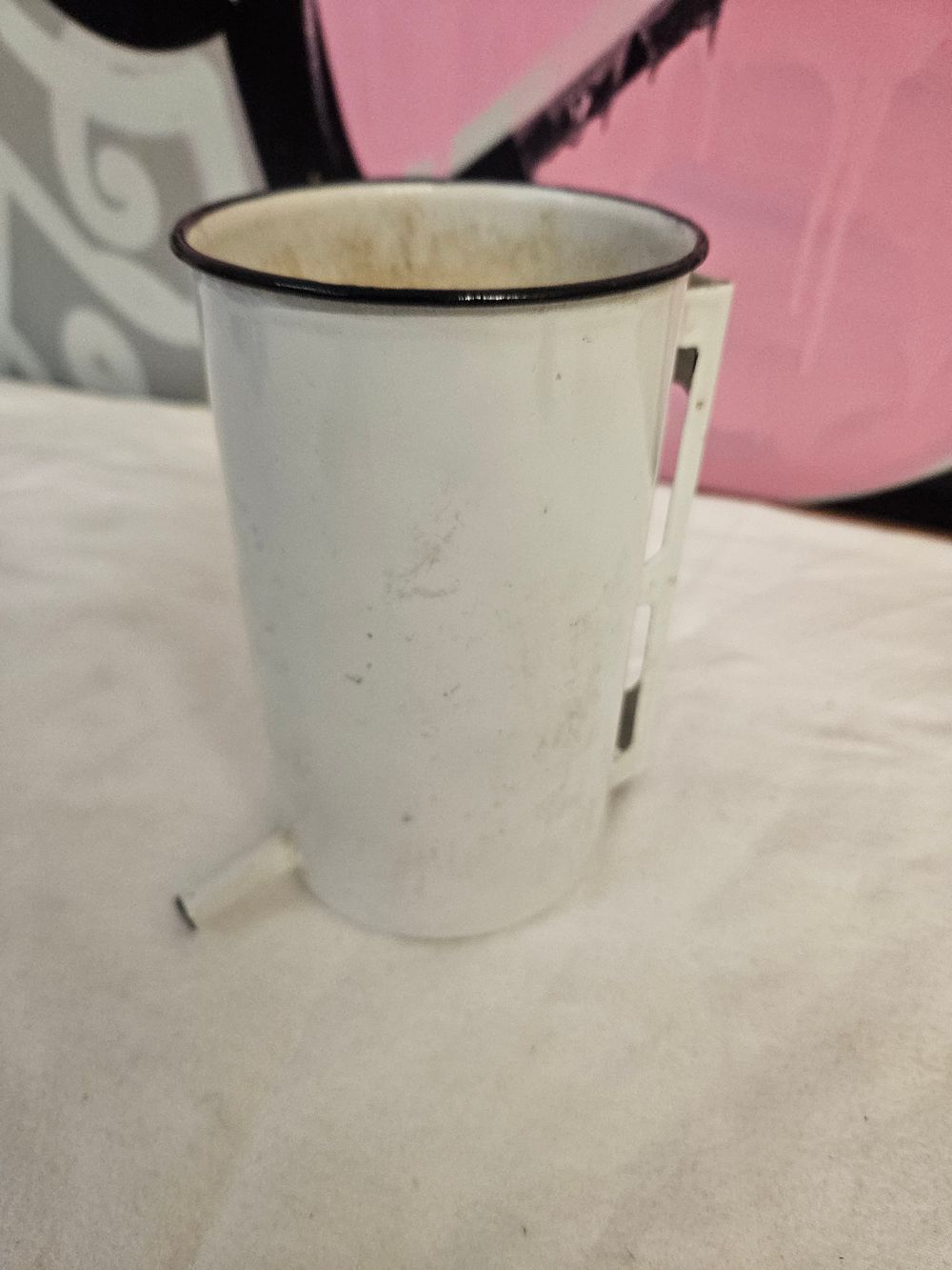 Lot 255 – A vintage white enamelled medical irrigator can with flexible tubing