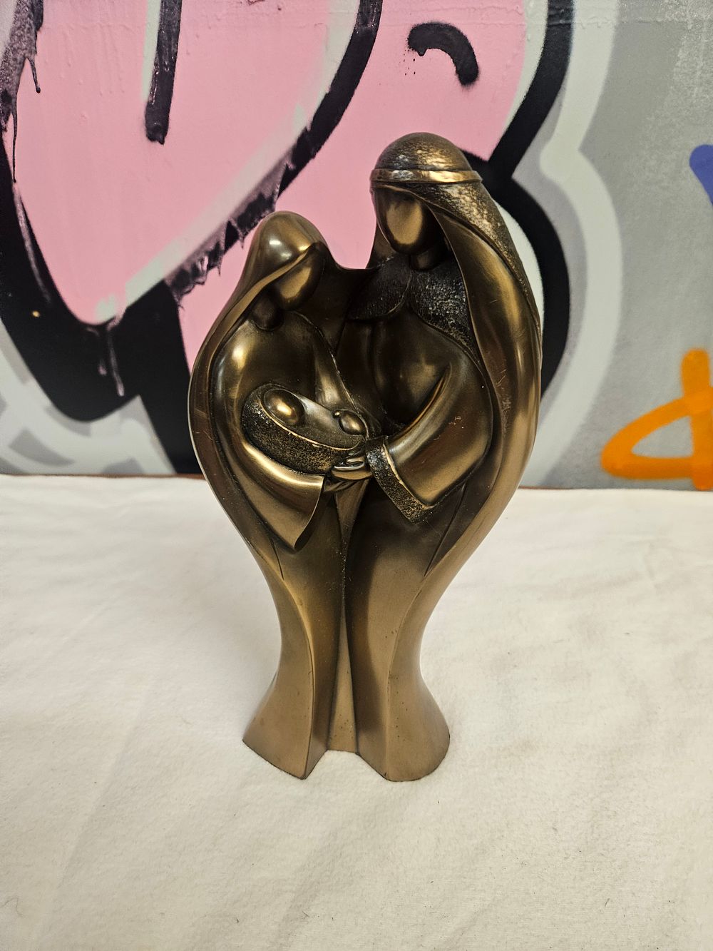 Lot 256 – A Contemporary Stylised Bronze-Effect Sculpture of a Family Group Attributed to Mario Nick