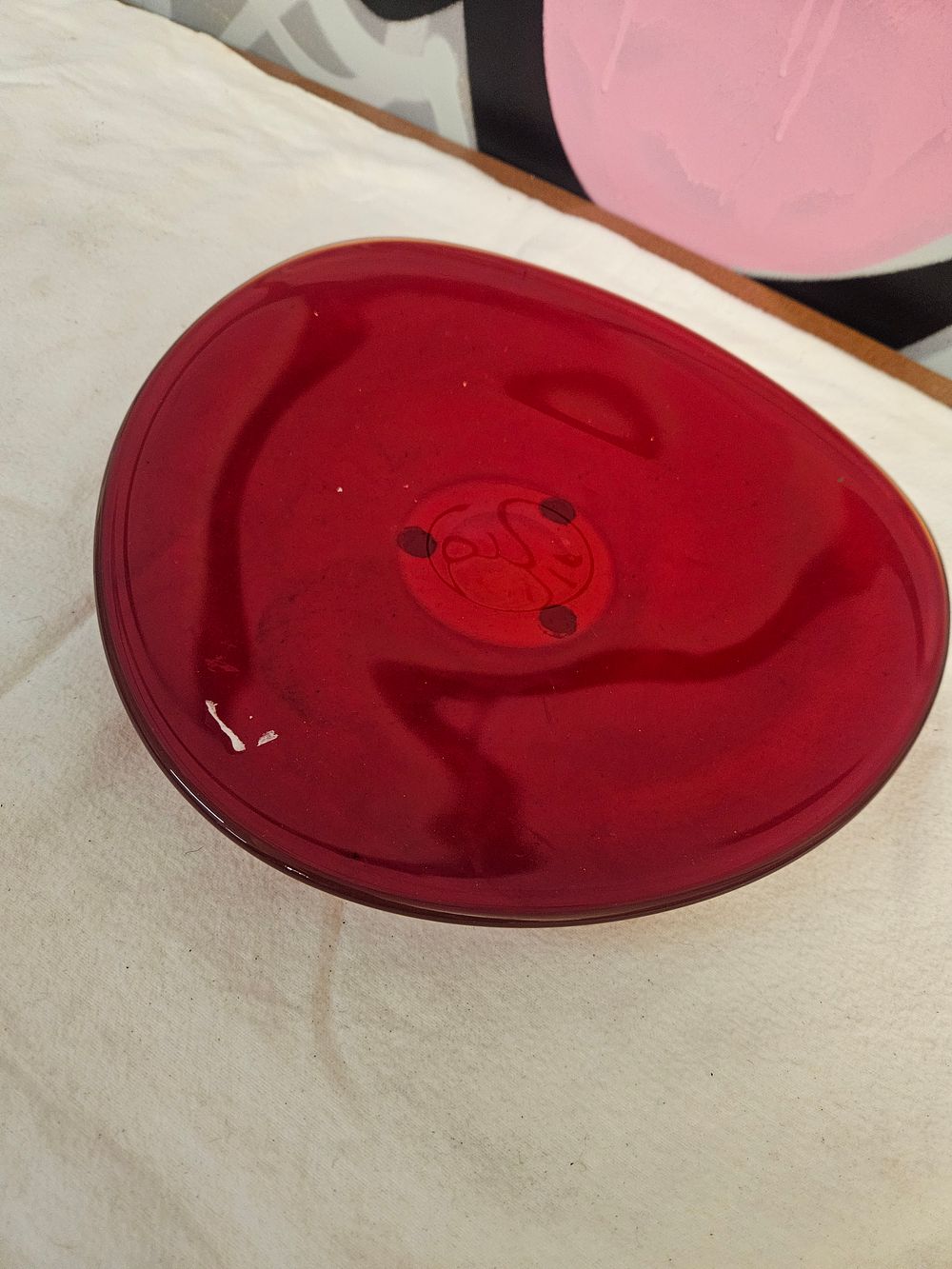 Lot 277 – A Dale Chihuly hand-blown ruby red studio glass plate, dated 1994