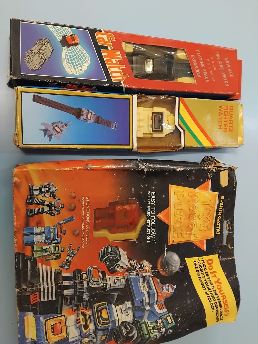 Lot 280 – Three 1980s transforming robot and vehicle digital watches in original packaging