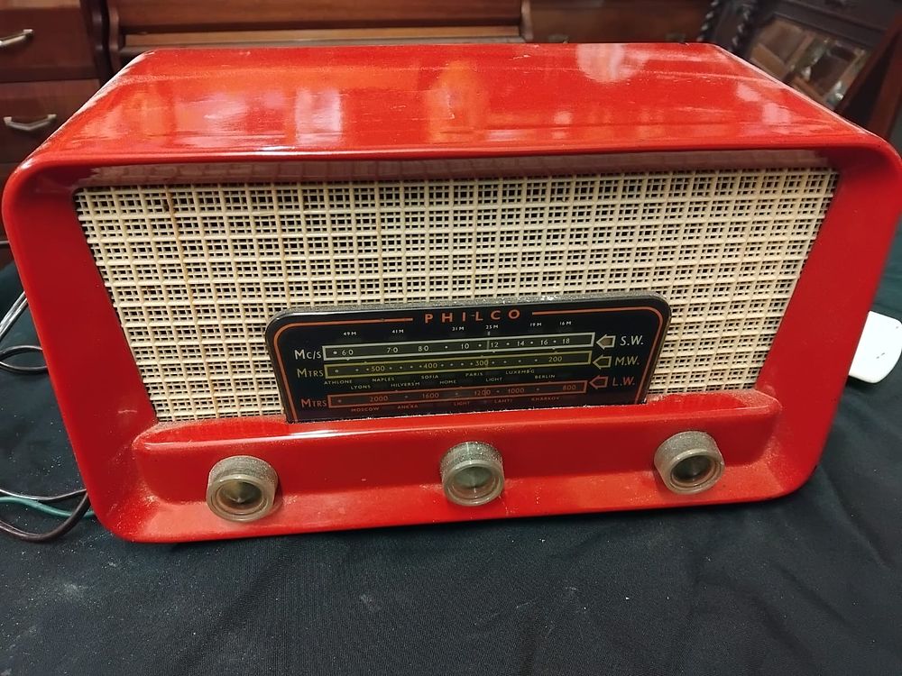 Lot 312 – A Philco Red Plastic Tabletop Radio Receiver working