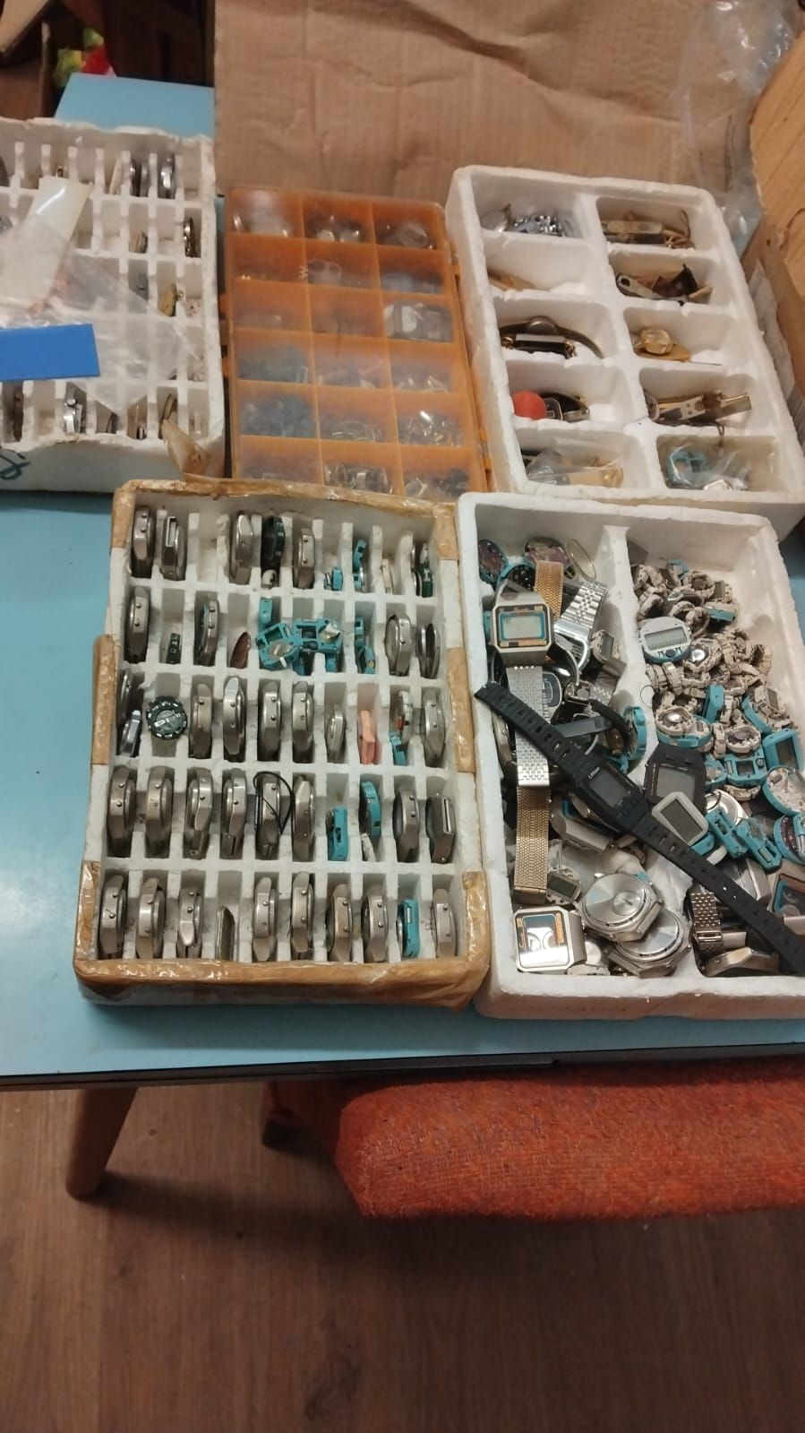Lot 321 – An Assortment of Watch Heads, Movements, and Components across Five Trays