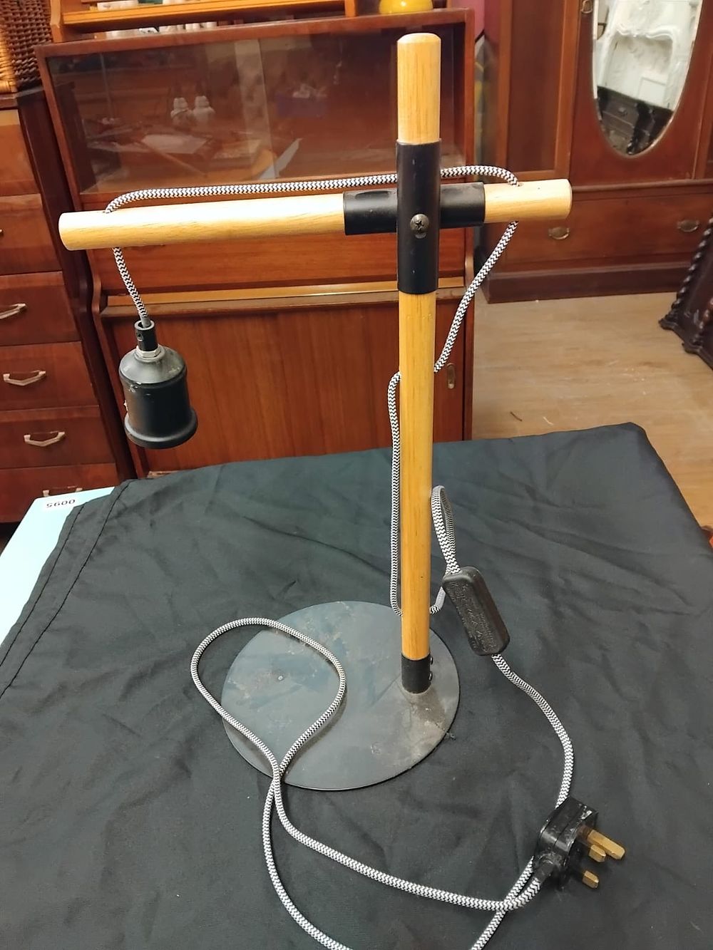 Lot 339 – A contemporary minimalist adjustable wood and metal table lamp