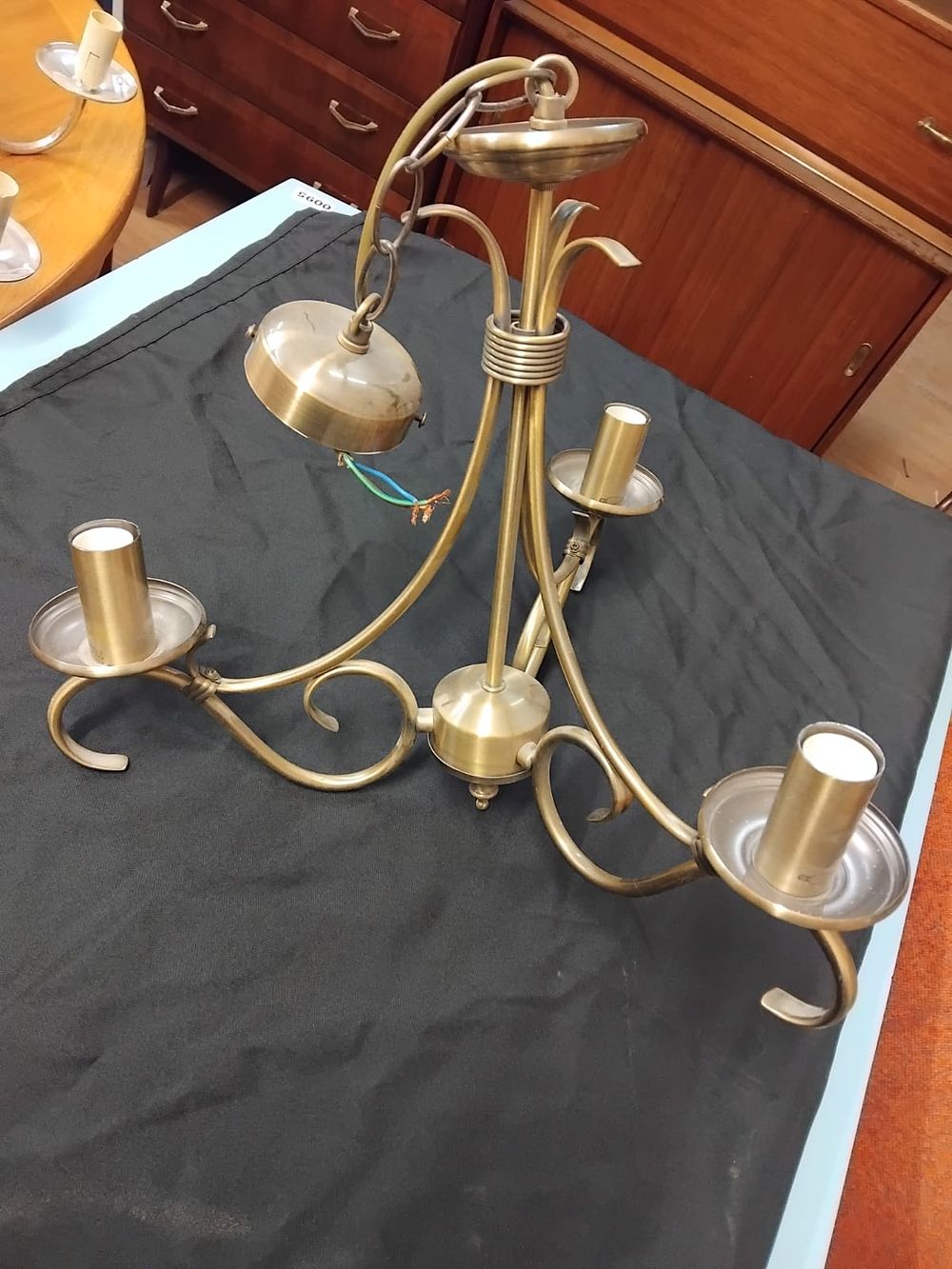 Lot 346 – A Three-Arm Brass Finished Neoclassical Style Chandelier