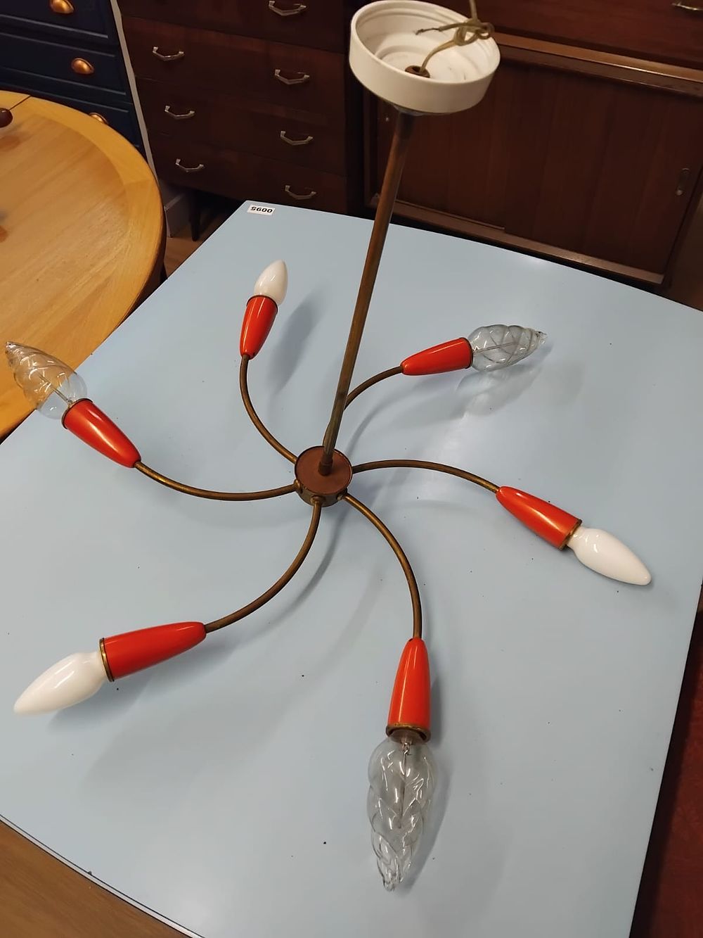 Lot 347 – A Mid-Century Modern six-Arm Brass and Red plastic Sputnik Chandelier