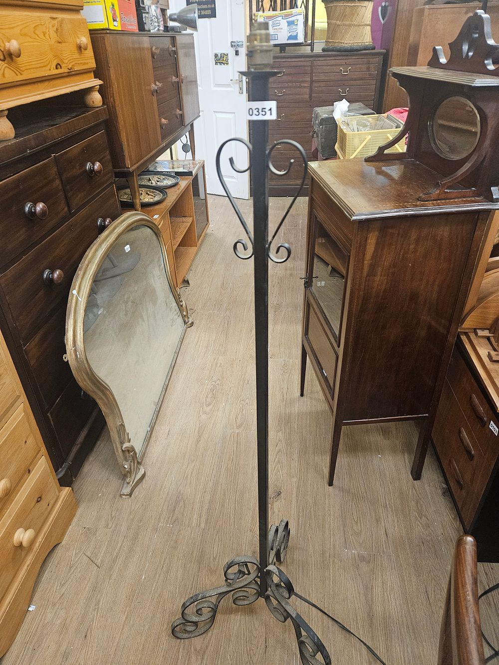 Lot 351 – A mid-20th-century black painted wrought iron floor lamp
