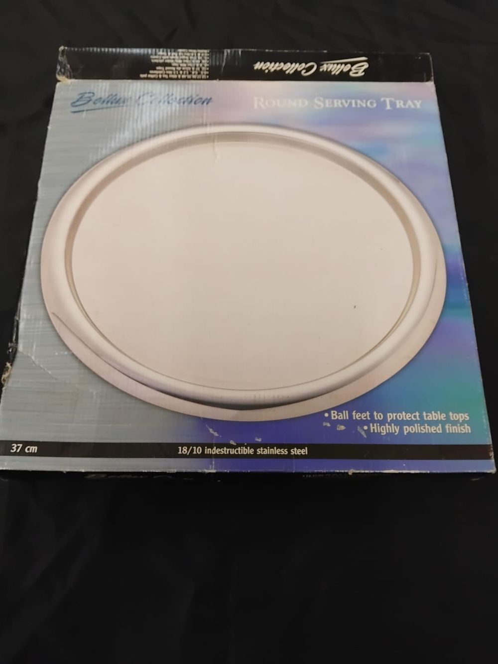 Lot 360 – A Bellux Collection 18/10 stainless steel round serving tray