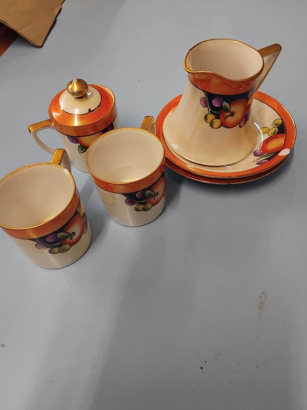 Lot 363 – A Set of Noritake Lustreware Fruit Pattern Porcelain Tableware