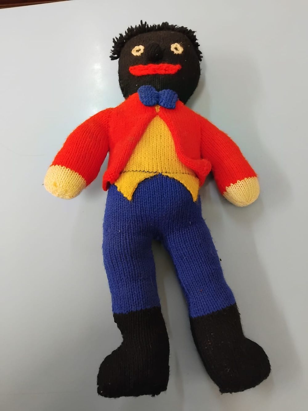 Lot 383 – A vintage hand-knitted soft doll of traditional Golly