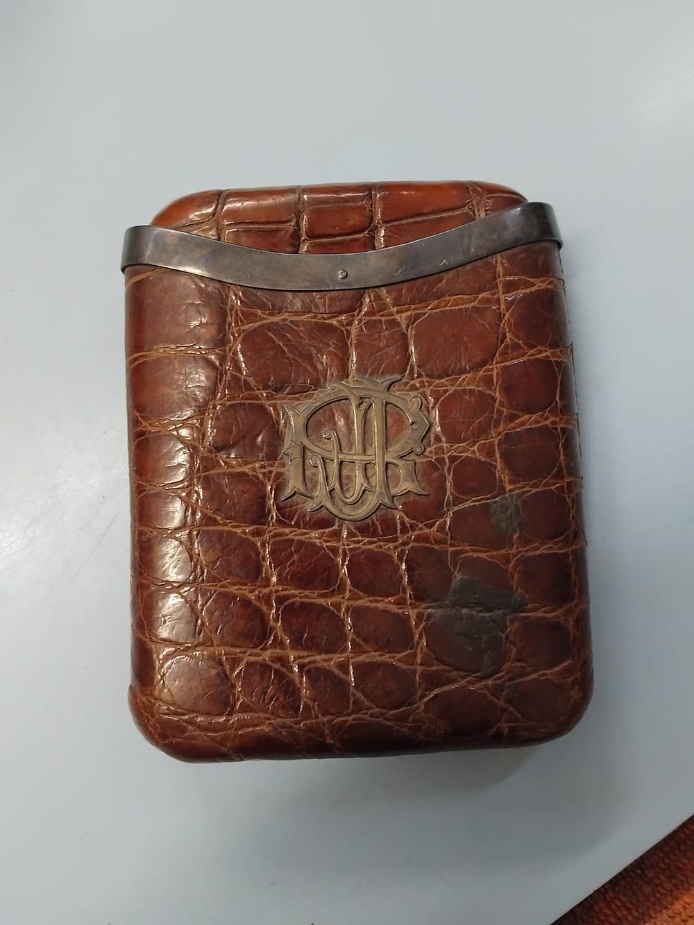 Lot 396 – A late Victorian telescopic crocodile skin pocket case with white metal monogram