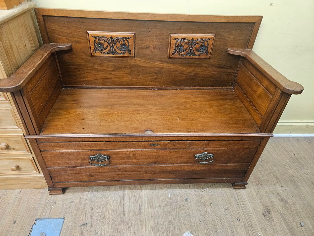 Lot 148 – An Edwardian Stained Hardwood Hall Settle