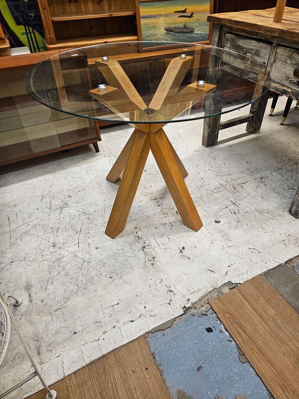 Lot 150 – Contemporary Circular Glass Top Dining Table with a Starburst Oak Base