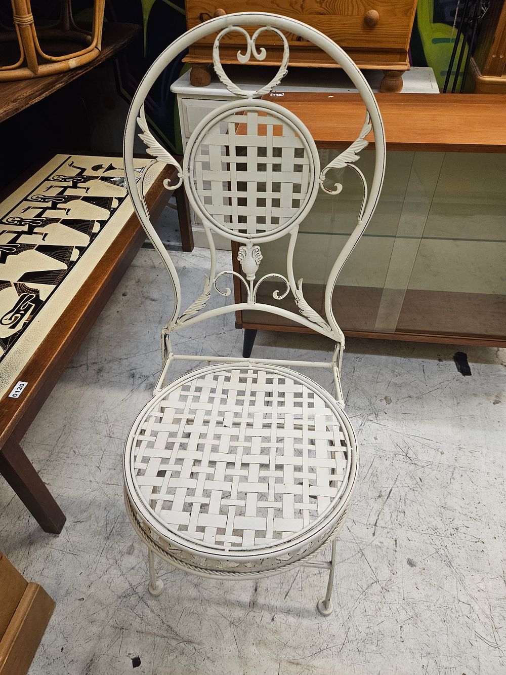Lot 153 – A vintage Woodard style white painted wrought iron garden chair